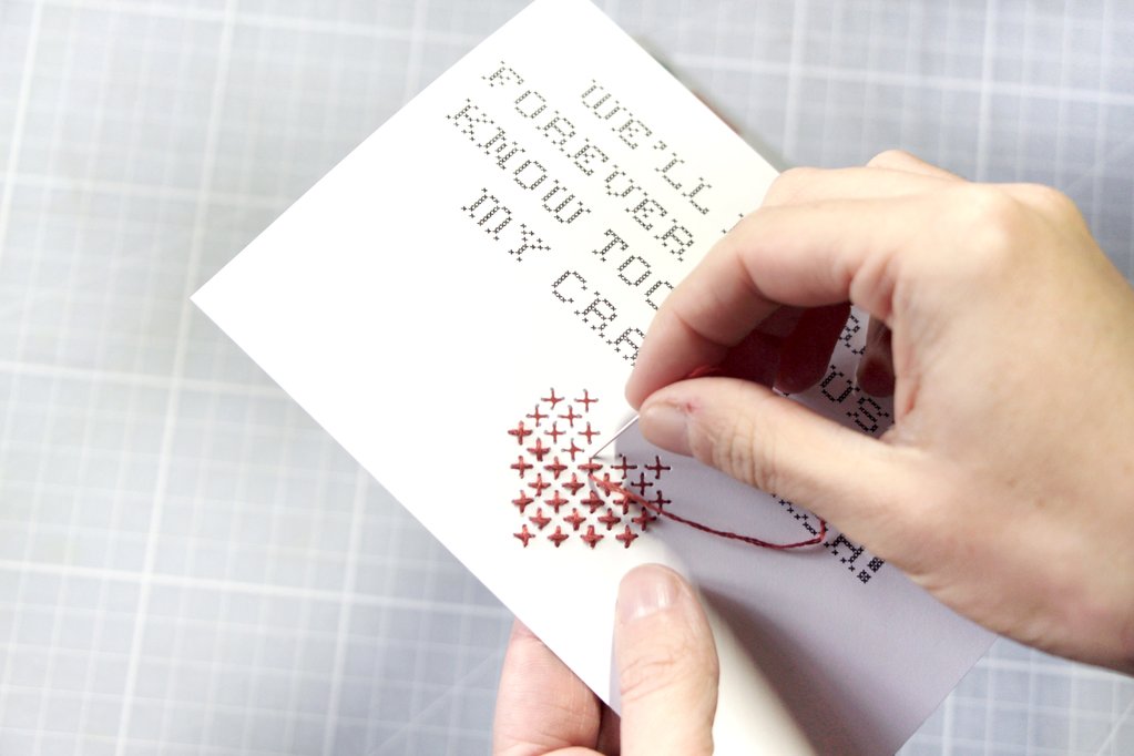 Then thread up a needle and stitch your crosses. To keep the tail hidden, start by pushing up from the back to the front (making the holes in advance makes it a lot easier!)