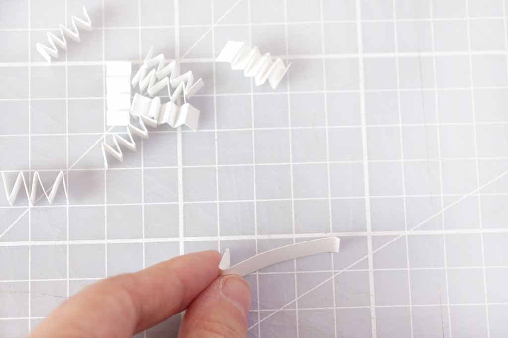 1. Print the PDF onto light card, you can use the right half as the card if you don't have a blank one. 2. Cut around the quote and flowers you want to use. 3. Cut strips of card and concertina it, stick this on the back of your quote or flowers with double sided tape. 4. Use a mix of foam squares and concertina card to make the elements stand out from the card. Now you're ready to celebrate!